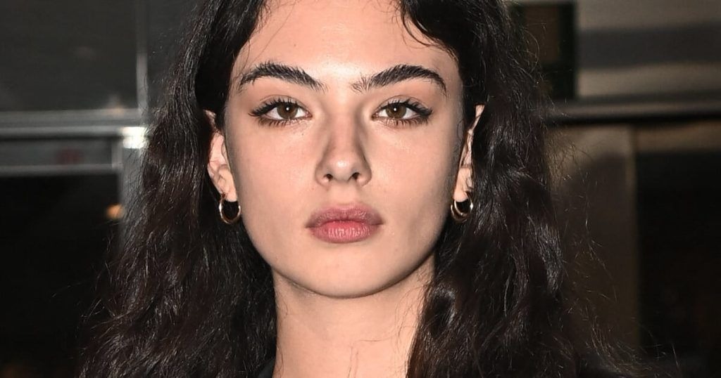 Looking like Monica Bellucci’s daughter, 18-year-old Deva Cassel, wearing a black lace dress, is seen filming a commercial in Rome