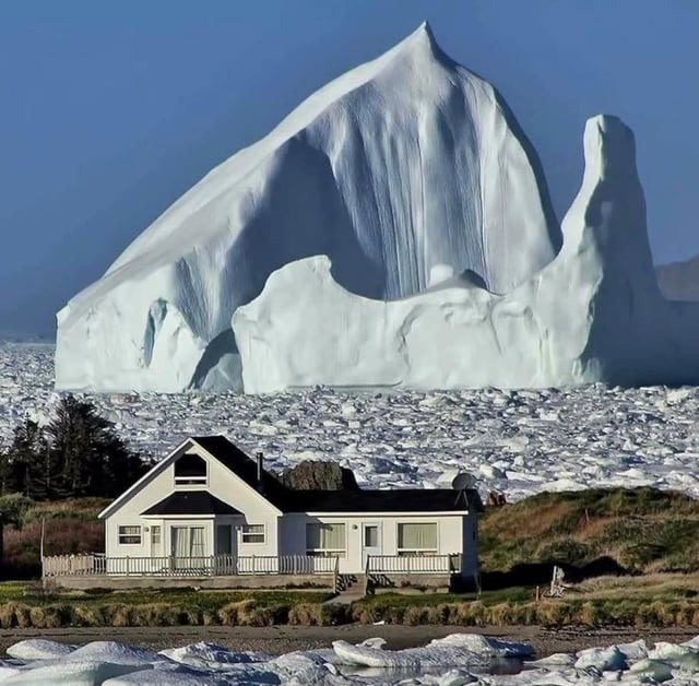 Iceberg floats close to a small village – when residents see what’s on it, they turn pale