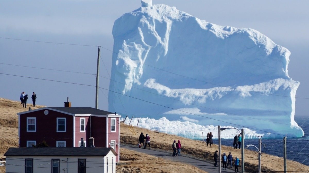 Iceberg floats close to a small village – when residents see what’s on it, they turn pale