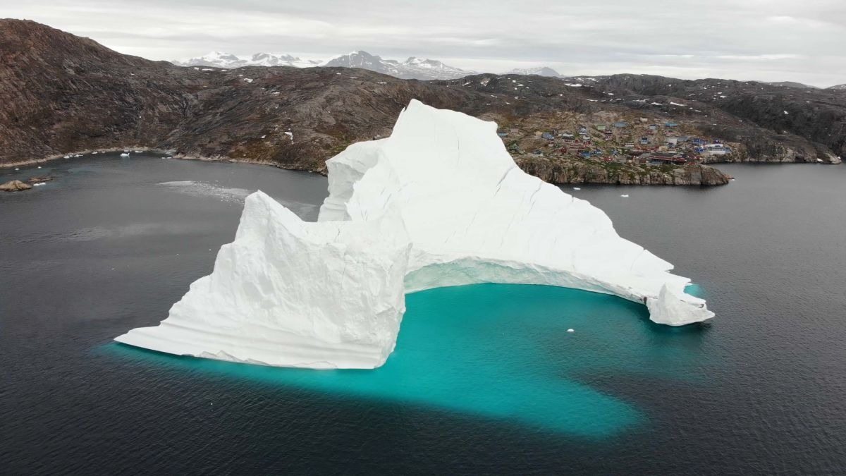 Iceberg floats close to a small village – when residents see what’s on it, they turn pale