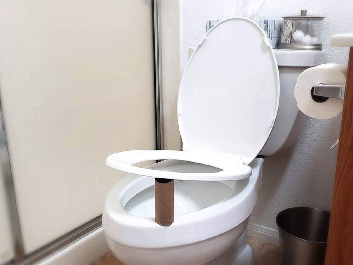 Should you leave an empty toilet paper roll or a red cup under the toilet seat at night?