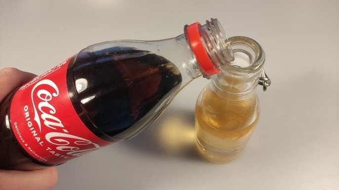 Mix white vinegar with cola