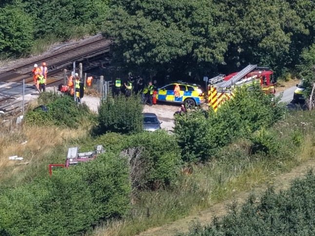 The driver cheats death when the van is hit by a train
