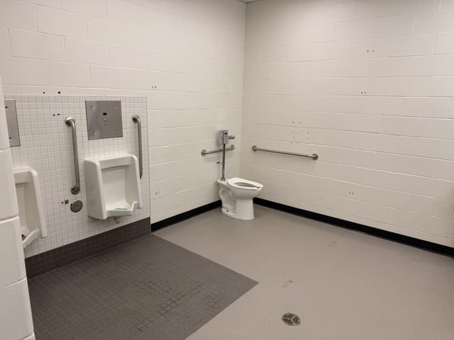 He Hit the Bathroom Wall—What He Discovered Inside Led to a Call to the Police