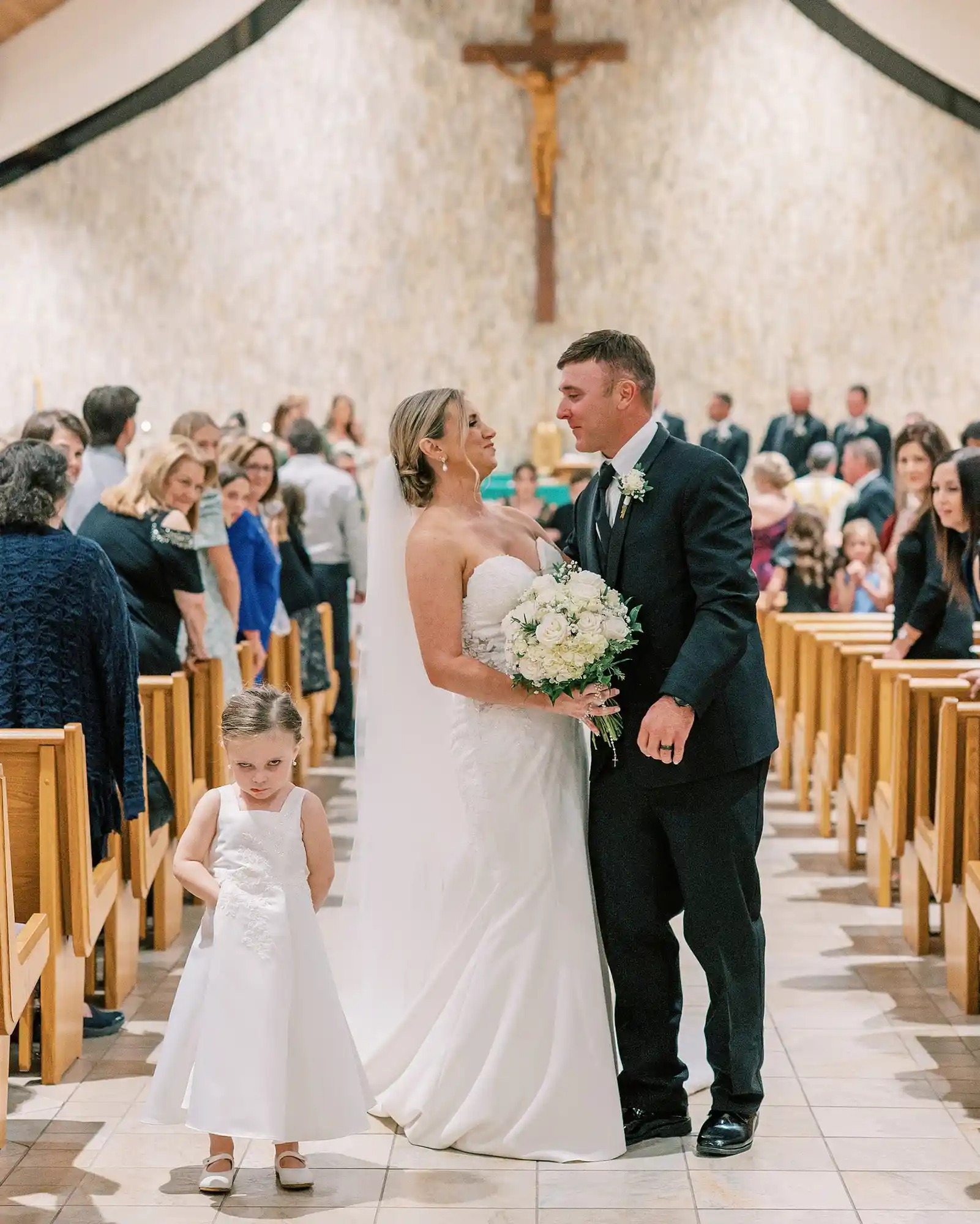 Everyone was looking at the newlyweds. But then the camera showed their daughter